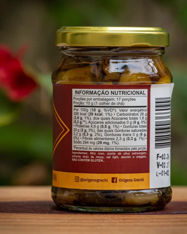 Tabela nutricional e ingredientes do Alho Confit Origens Grechi, indicando uso de alho roxo e sal light.